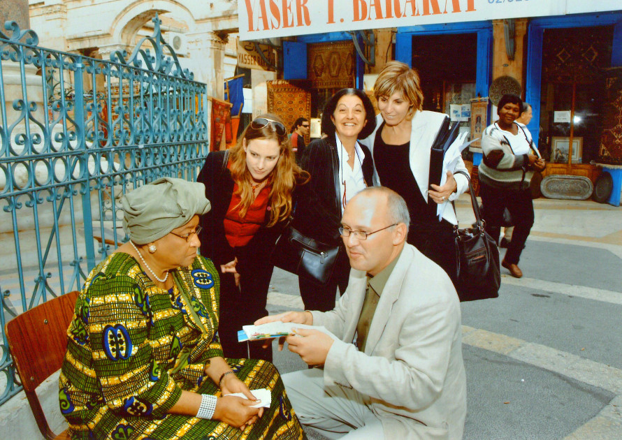 Guiding President Ellen Johnson of Liberia at the Muristan market, Jerusalem